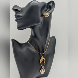 Sea team Napier necklace and seashell Monet earrings.